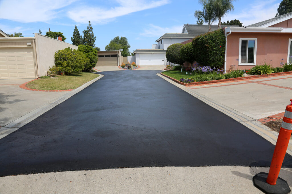 a newly poured asphalt driveway