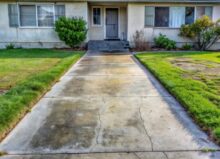 Concrete walkway up to the front door of a house